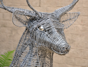 Part of a sculpture of a deer or bull, made of wire